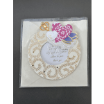 Decorative greeting card with layered hearts and gold accents in a plastic sleeve