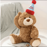 Plush teddy bear wearing a birthday party hat