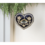 Heart-shaped hanging ornament with an eye and floral beadwork