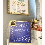Godiva assorted chocolates in a purple and gold gift box