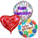 Three birthday and anniversary balloons, including a red heart balloon