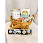 Gift basket with candles, soap, bath salts, and lip balm