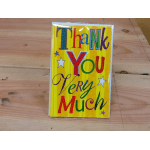 Colorful thank-you greeting card on a wooden surface