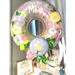 Round floral balloon with "Love You Mom" text and pastel flower prints