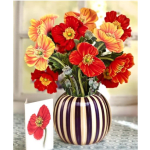 Bright red and orange flowers in a striped vase with a matching card