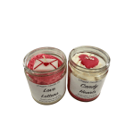 Two heart-themed candles in glass jars with pink and white wax