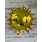Gold sun-shaped smiley balloon with pink cheeks