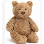 Plush teddy bear sitting upright on a white background