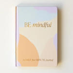 Pastel journal with the words "BE mindful" on the cover
