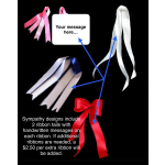 Assorted sympathy ribbons with message tags on a black background