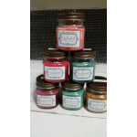 Stacked scented candles in glass jars with brown lids