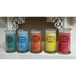 Five colorful candles in glass jars lined up on a shelf