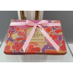 Gift box of Godiva chocolates tied with a pink ribbon