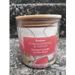 Strawberries and cream scented candle in a glass jar with a wooden lid