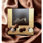 Box of Lindt gourmet truffles on satin fabric