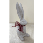 White speckled rabbit figurine with a burgundy ribbon bow