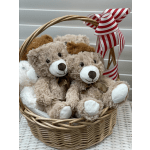 Basket of teddy bears with a red-and-white striped ribbon