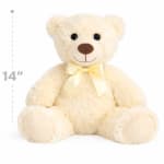 Cream teddy bear with a yellow ribbon bow