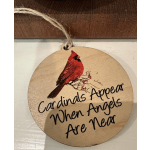 Round wooden ornament with a red cardinal and the words "Cardinals Appear When Angels Are Near"