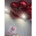 Red heart-shaped balloons with gold and white hearts and "LOVE" text