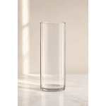 Clear cylindrical glass vase on a light surface