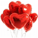 Cluster of red heart-shaped balloons on thin sticks