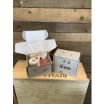 Two open gift boxes with candles and bath items, one labeled Mom