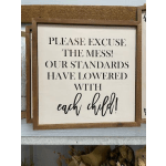 Framed wooden sign with the text "Please excuse the mess!"