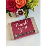 Flowers beside a thank-you candy box