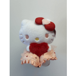 Hello Kitty plush holding a red heart and wearing a pink skirt