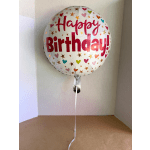 Round foil balloon reading Happy Birthday with heart and star confetti
