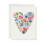 Greeting card with a heart made of colorful flowers