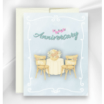 Anniversary card with a bride and groom table scene and flowers