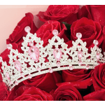 Red roses with a jeweled tiara resting on top