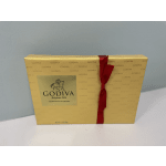 Gold Godiva chocolate gift box tied with a red ribbon