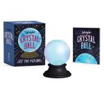 Crystal ball on a black stand with a product box and booklet