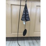 Black memorial wind chime with a hanging oval clapper