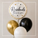 Cluster of gold, black, and white balloons with a round logo balloon