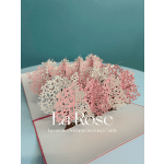 Pop-up greeting card with pink and white floral cutouts