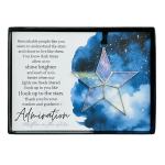 Star-shaped hanging ornament in a gift box with a printed quote