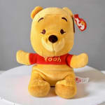 Yellow Winnie the Pooh plush toy in a red shirt