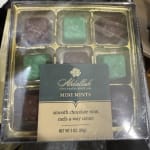 Box of assorted mini mint chocolates in a clear plastic tray