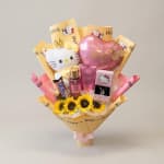 Gift bouquet with sunflowers, Hello Kitty items, and a pink heart balloon