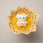 Hello Kitty plush on a yellow rose bouquet with printed wrapping