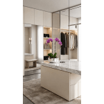 Purple orchids in a silver pot on a marble island in a modern closet