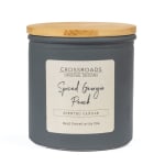 Gray scented candle in a jar with a wooden lid