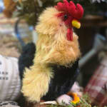 Plush rooster figurine with red comb and yellow beak