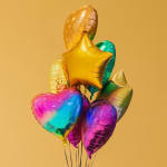Cluster of metallic heart and star balloons on a plain background