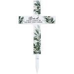Decorative cross-shaped sign with a message for Dad and a stake