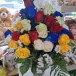 Bouquet of multicolored roses in a clear vase